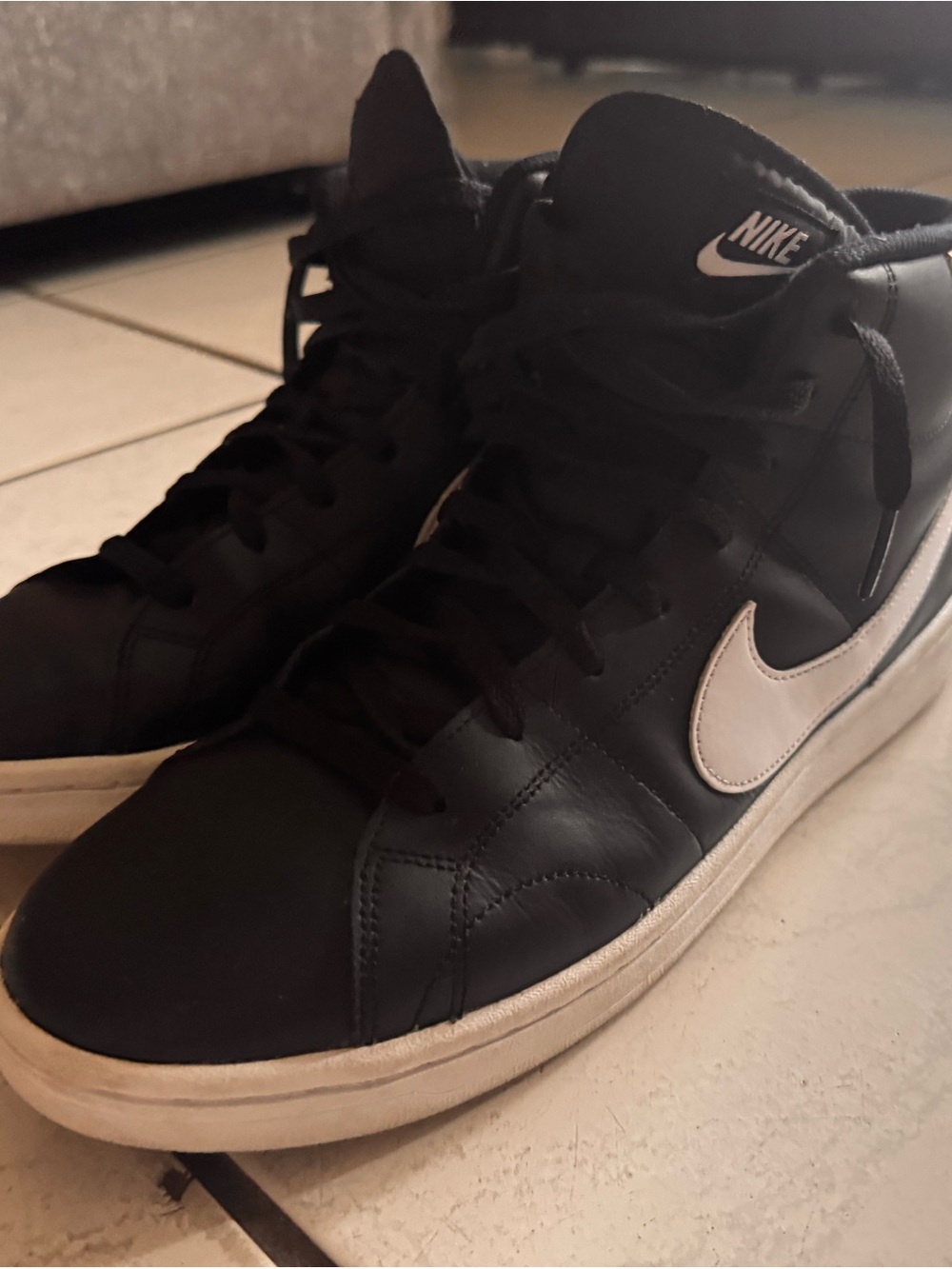 Nike Men’s Black High-Top Sneakers with White Swoosh Accent